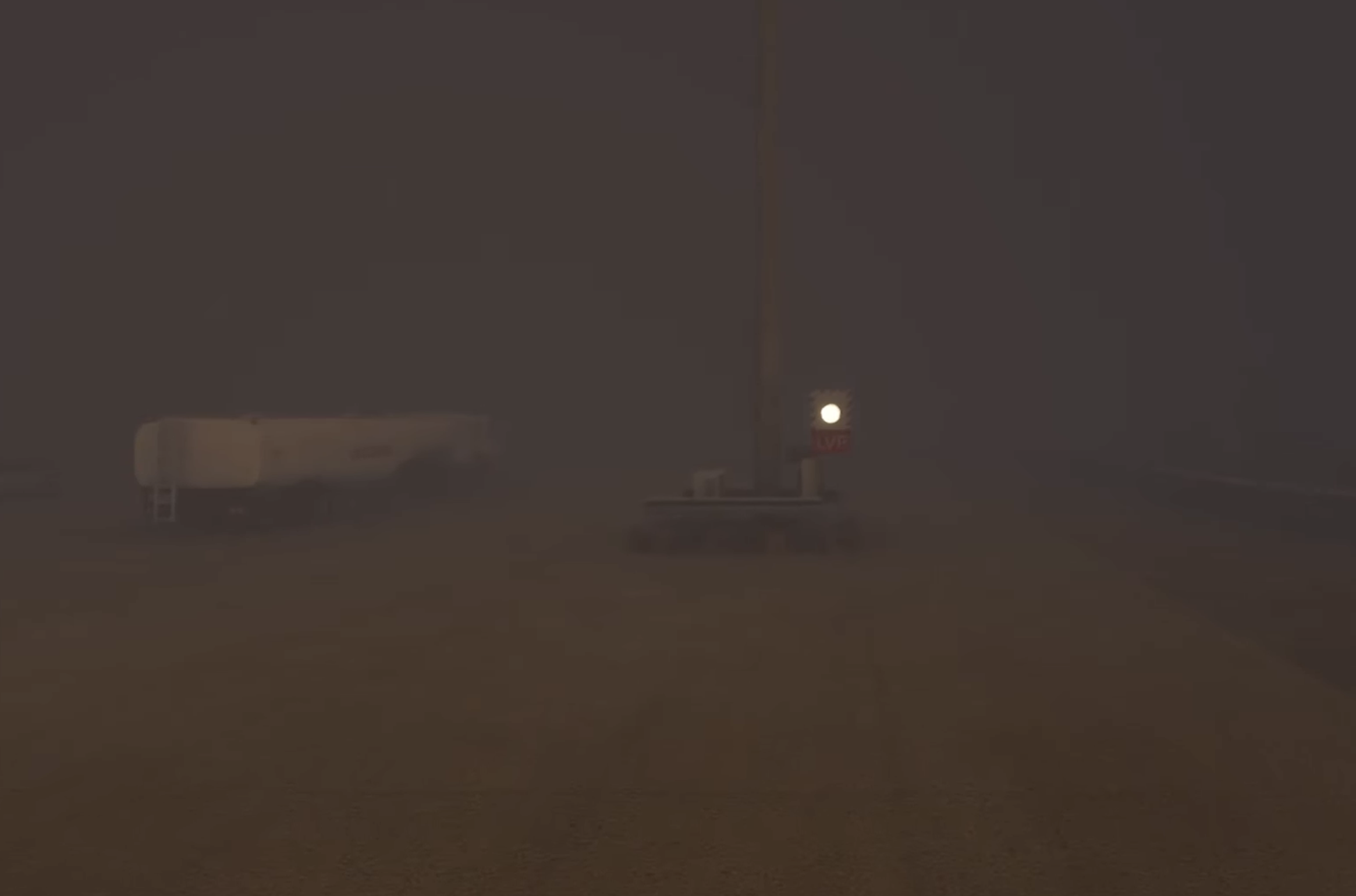 Approach view at GCXO in reduced visibility showing terrain and runway environment